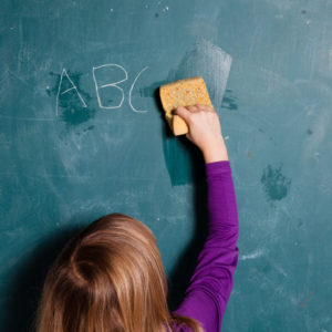 student wiping slate clean for a fresh start